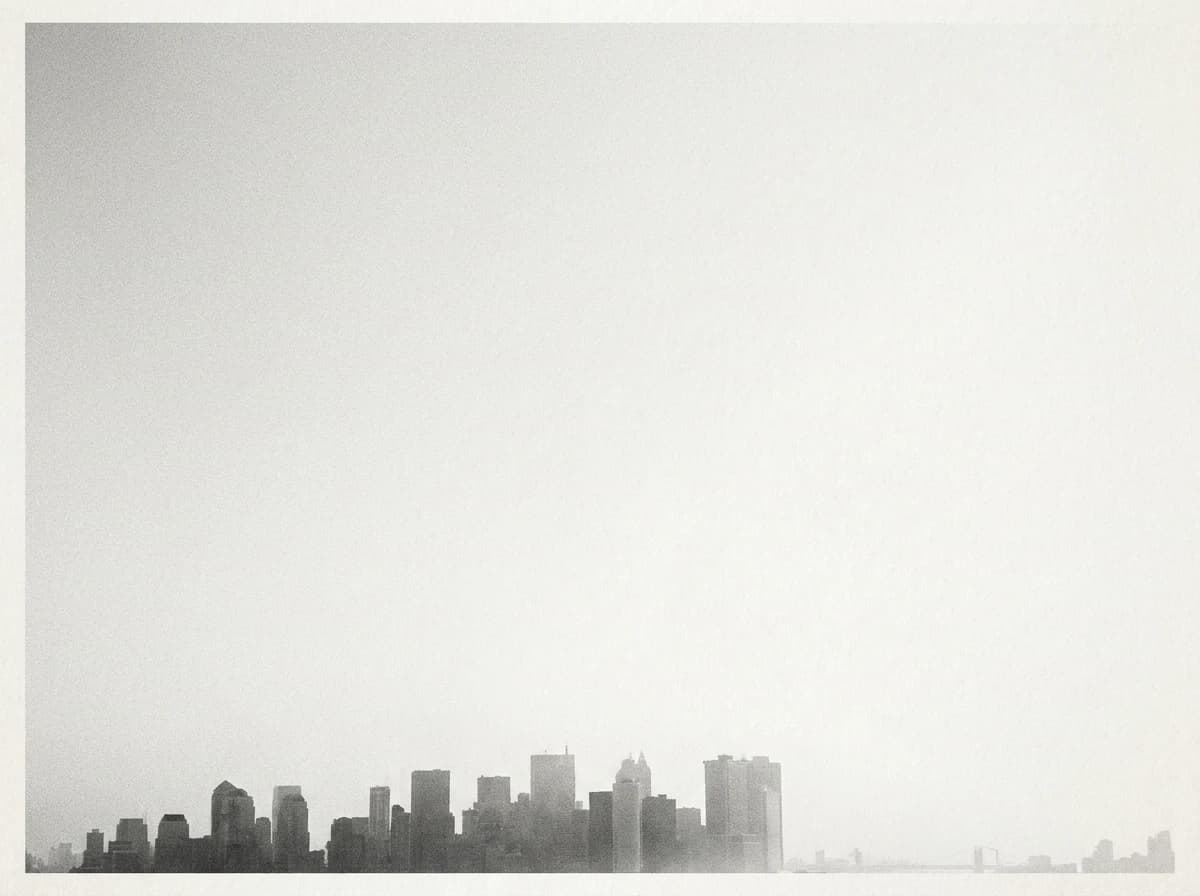 City skyline against a rising light